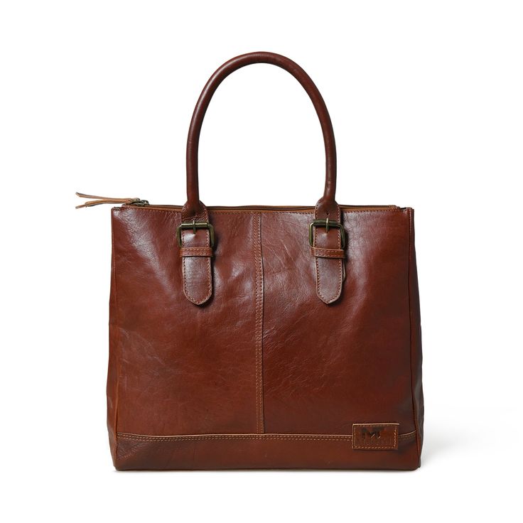 Introducing the City Chic Brown Leather Shoulder Tote—a versatile office bag designed for elegance and practicality. With a central compartment, inside pocket, and sturdy handles adorned with stylish buckles, it seamlessly blends class with functionality. Crafted from naturally tanned buffalo leather, this bag effortlessly transitions from office sophistication to casual chic. Perfect for brunch or quick outings with friends, it complements your style while prioritizing environmental responsibil Cognac Leather Laptop Bag For Work, Classic Brown Briefcase For Everyday Use, Classic Brown Everyday Briefcase, Classic Brown Satchel For Work, Classic Cognac Laptop Bag For Everyday Use, Cognac Satchel Briefcase For Work, Cognac Satchel For Workwear, Cognac Leather-lined Laptop Bag For Work, Cognac Leather Lined Laptop Bag For Work