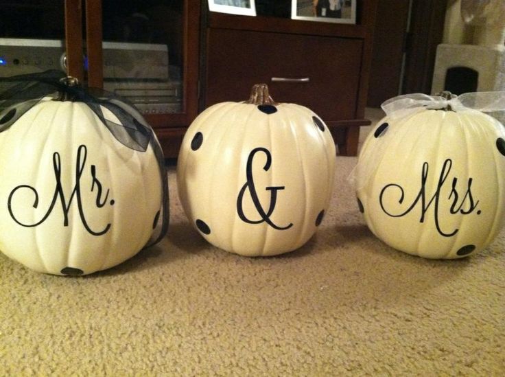 three white pumpkins decorated with black polka dots and the word mr and mrs painted on them