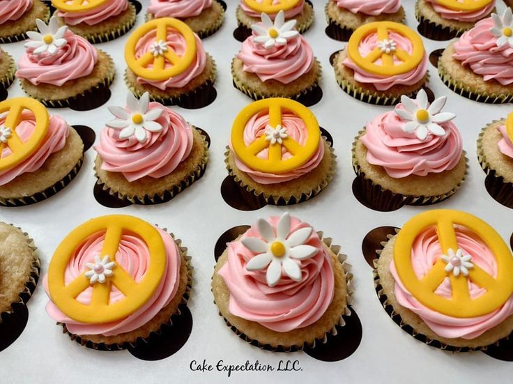 cupcakes decorated with pink and yellow frosting