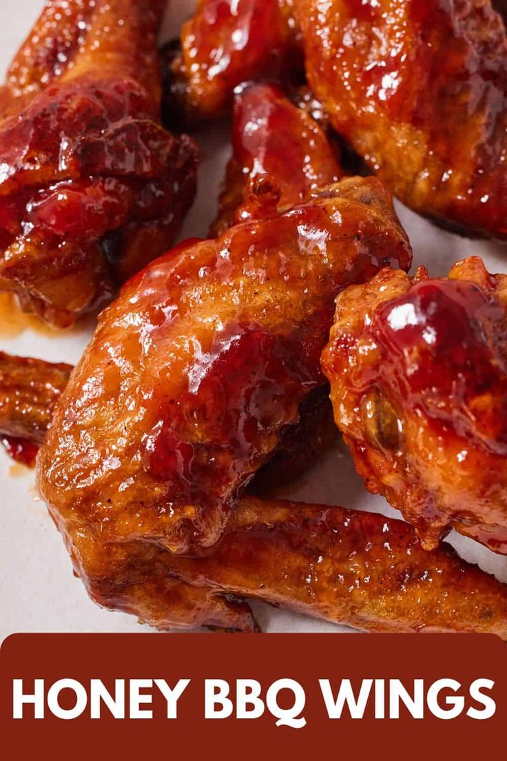 honey bbq wings on a white plate with the words, honey bbq wings