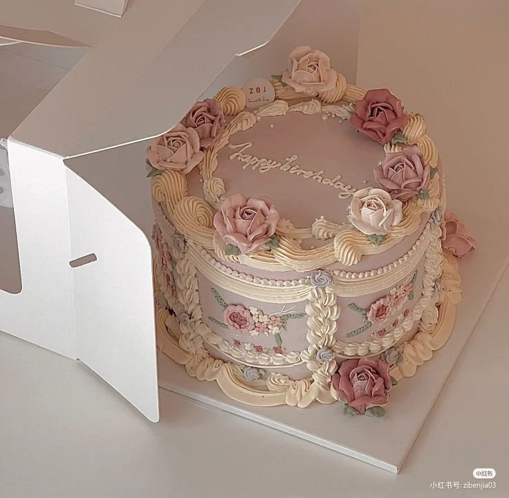 there is a cake in the box with flowers on it