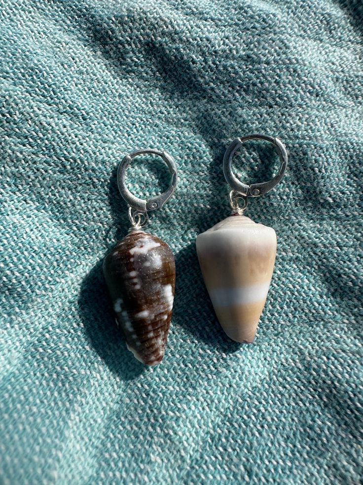 One of a kind handmade asymmetrical shell earrings! Each shell was handpicked on the beaches and ocean depths of O'ahu. Each shell is hand drilled and wire wrapped by hand with love! Made with sterling silver wire, perfect for everyday wear! They will not tarnish and can be worn in the ocean! Handmade Sterling Silver Shell For Beach, Sterling Silver Wire Wrapped Earrings For Beach, Beach Wire Wrapped Sterling Silver Earrings, In The Ocean, Shell Earrings, Silver Wire, The Ocean, Wire Wrapped, Wire Wrapping