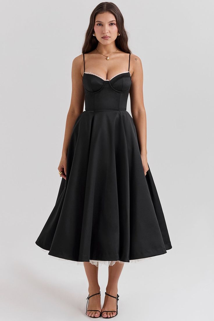 Elevate your style with the Mademoiselle Black Tulle Midi Dress. The French-inspired halter design, delicate lace and slimming waist will add a touch of sophistication to any occasion. Stay effortlessly chic in this mid-length dress while embracing your inner fashionista.