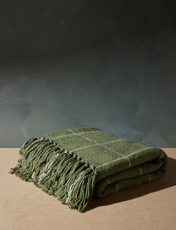 two green towels stacked on top of each other