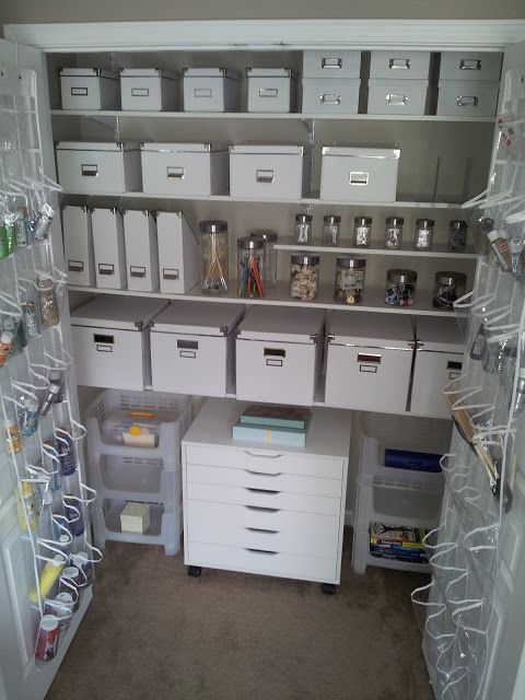 an organized pantry with lots of drawers and bins