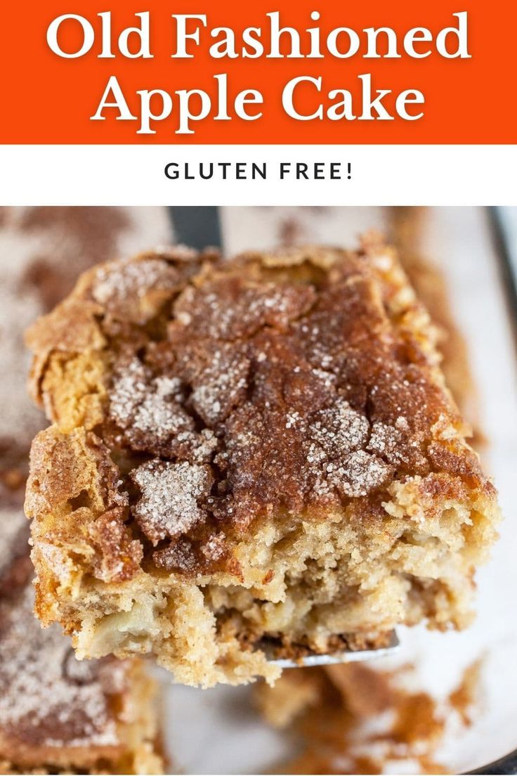 an old fashioned apple cake with powdered sugar on top is being held by a fork