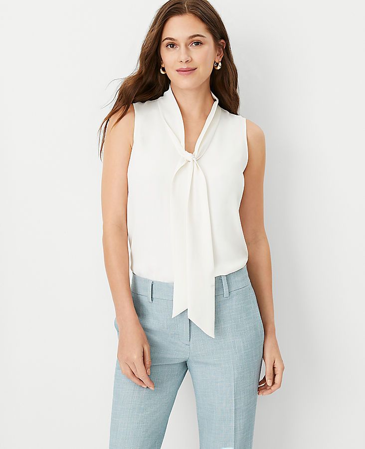 Elevate your wardrobe with the Ann Taylor Petite Bow Neck Shell Top, a piece that blends sophistication with a touch of whimsy. This winter white top is perfect for women who appreciate elegant details and a flattering fit.

- **Size:** Petite Large
- **Color:** Winter White
- **Material:** 100% Polyester
- **Fit:** Straight Fit
- **Length:** 25 1/4" long
- **Gender:** Female
- **Age Group:** Adult

Featuring a charming V-neck with self-ties that form a bow, this sleeveless blouse is both stylis Lisa Fischer, White Bow Tie, Shell Top, Fall Capsule Wardrobe, Petite Tops, White Bow, Spring Wardrobe, Work Blouse, Tie Neck