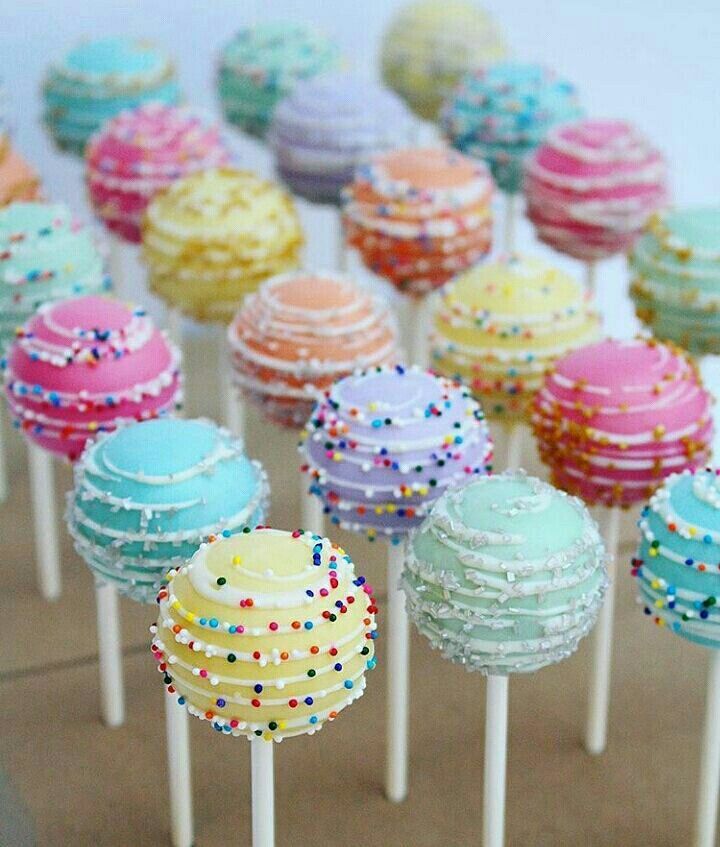 there are many cake pops with sprinkles on them