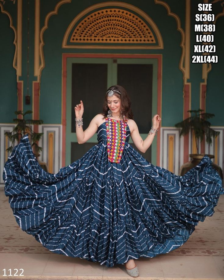 Beautiful Leheriya Print Work With Kutchi Patch Work In Chinon Fabric With Sleeveless Readymade Stitch Gowns, Navratri Gown Collection 2024 Fabric - Chinon Fabric (Sleeveless) Lining (Inner) - Cotton (Full Up to Bottom) . Type - Readymade Size - S(36), M(38), L(40), XL(42), XXL(44) Work - Leheriya Print Work With Kutchi PatchWork Length - 56 Inch Flair - 12 Meter Weight - 1 Kg Occasion - Navratri Festival For More Latest Trending Women's Outfits Just Click On The Below Link, Https://www.etsy.com/in-en/shop/ethnicrang . Disclaimer: Actual Color May Slightly Vary From The Image Shown. . Please Click The 𝗙𝗮𝘃𝗼𝗿𝗶𝘁𝗲 𝗦𝗵𝗼𝗽 Box In The Top Left-hand Corner And Share. Your Likes And Shares Are Much Appreciated. . Do You Want To Buy It Later? Click On The Heart ❤️ To Your Right That Says, Navratri Gown, Purple Anarkali, Indowestern Gowns, Layered Gown, Indian Anarkali, Gown Party Wear, Diva Style, Simple Gowns, Robes Vintage