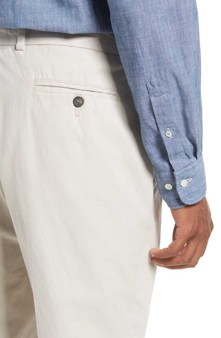 Lightweight cotton poplin elevates versatile pleated khakis in a traditional, full-tailored cut. 18" leg opening; 10" front rise Zip fly with button closure 100% cotton Machine wash, tumble dry Imported Fitted Cotton Chinos For Semi-formal Occasions, Business Casual Cotton Bottoms With Belt Loops, Casual Cotton Chinos For Semi-formal Occasions, Unstructured Cotton Bottoms With Straight Hem, Cotton Bottoms With Belt Loops For Business Casual, Summer Tapered Leg Chinos In Chino Cotton Twill, Tailored Cotton Dress Pants With Belt Loops, Classic Cotton Trousers, Spring Business Casual Cotton Bottoms