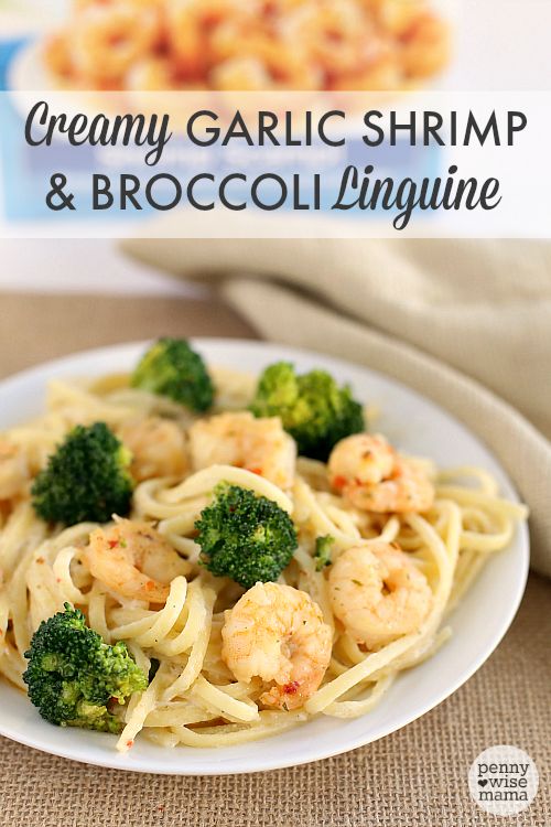 a white plate topped with shrimp and broccoli