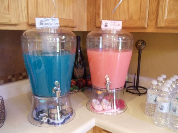 two blenders filled with different colored drinks