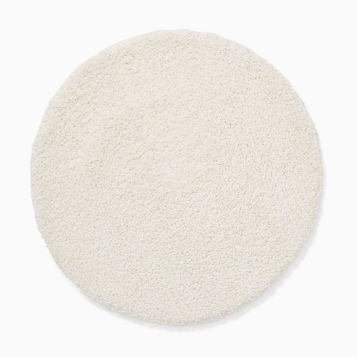 a white round rug on a white background