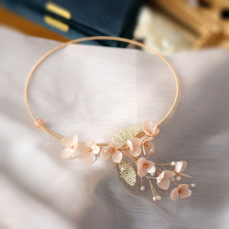 This simple yet elegant design will add a romantic flair to your look. Several delicate pink cherry flowers are layered to form a flawless collection. This collection includes a cherry-blossom-themed bracelet, earrings, hairpin, necklace, and ring. All the flowers have been properly dehydrated before being coated/cast in resin so that the color stays fresh-looking for seasons. Delicate Spring Jewelry With 3d Flowers, Spring Feminine 3d Flowers Jewelry, Spring Flower Shaped Jewelry With 3d Flowers, Spring Rose Gold Flower Jewelry, Floral Jewelry For Spring Weddings, Chic Spring Jewelry With Flower Decoration, Spring Chic Jewelry With Flower Decoration, Rose Gold Flower-shaped Jewelry For Spring, Feminine Blossom Jewelry For Spring