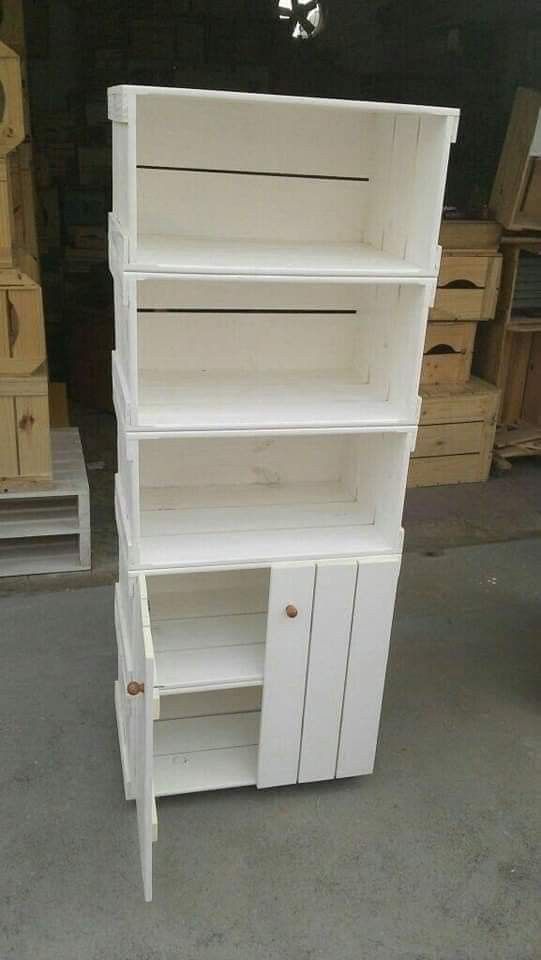 a white bookcase with doors and drawers