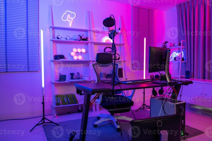 a room with purple lighting and various items on the desk in front of it,