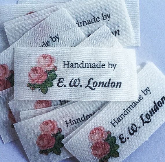 embroidered labels with pink roses on them