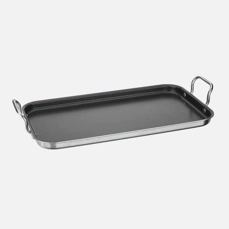 an empty metal tray with handles on a white background