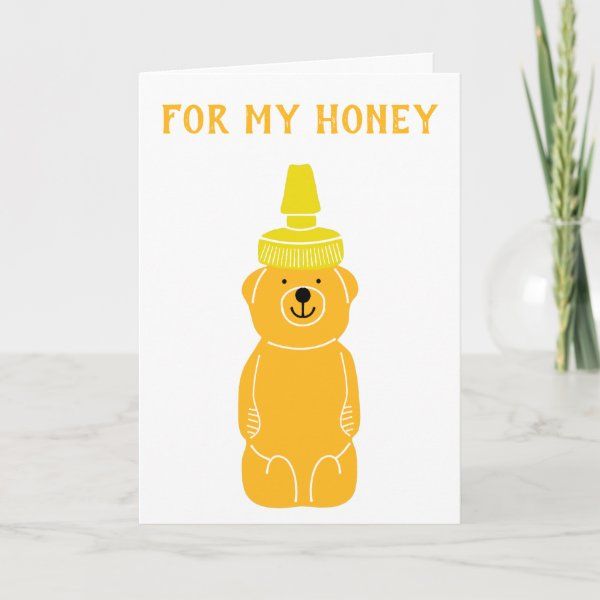 a card with an image of a bear wearing a hat on it's head