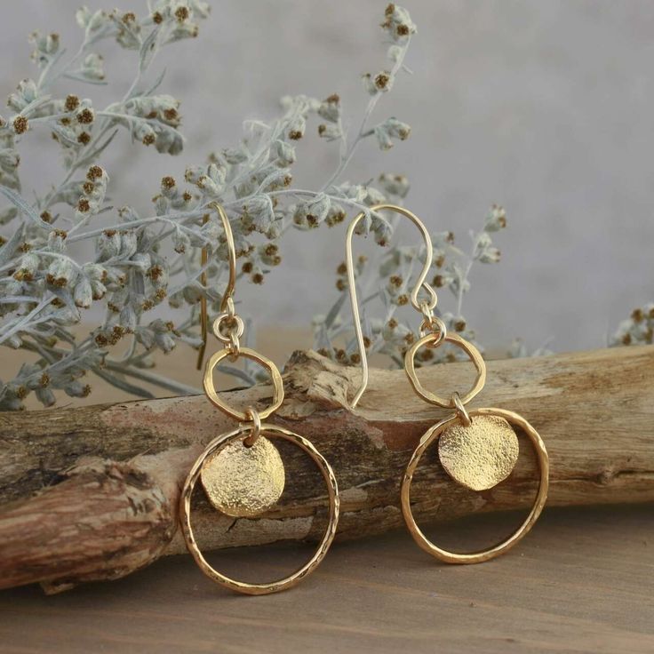 Lightweight and elegant... Our Gold Crushing Earrings come to you in vermeil in easy on French wires. A fun dangle of gold connected circles and a richly textured round disc in the larger ring. Overall length is over 1.5 inches long, and the most significant ring measures about .75 inches wide. Lightweight and elegant are the perfect descriptors for these earrings.  You'll soon be crushing over your new faves! Metal: Vermeil**Style: French Wire HookMSRP: $68.99 Part of the appeal of handcrafted Nickel-free Gold Open Circle Jewelry, Gold Open Circle Nickel-free Earrings, Nickel-free Gold Open Circle Earrings, Gold Nickel-free Open Circle Earrings, Gold-tone Hammered Dangle Jewelry, Gold Circle Earrings 14k Gold Filled, Hammered Yellow Gold Circular Earrings, Yellow Gold Hammered Circle Earrings, Hand Forged Gold Round Disc Jewelry