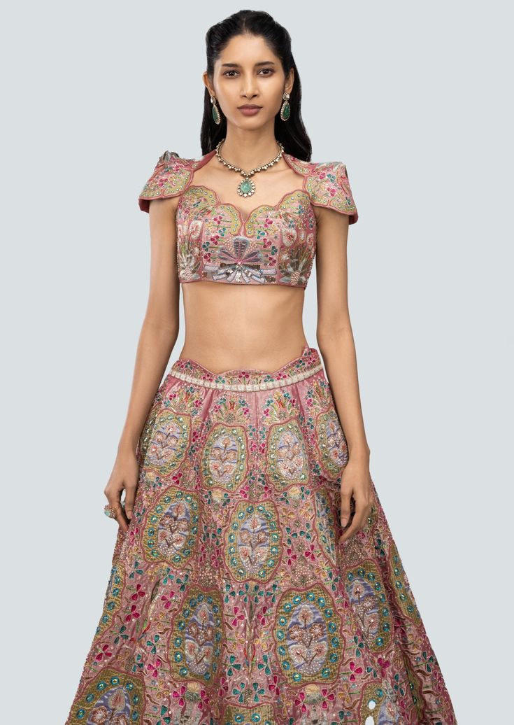 Rose dust multicolored applique and heavy embellished kali tissue lehenga with cap sleeve blouse and scallop net dupatta. Embroidered Lehenga With Cape Sleeves In Organza, Floral Embroidered Choli With Cape Sleeves For Parties, Party Choli With Cape Sleeves And Floral Embroidery, Party Choli With Floral Embroidery And Cape Sleeves, Embroidered Lehenga With Cape Sleeves For Reception, Pink Lehenga With Dupatta And Cape Sleeves, Pink Choli With Cape Sleeves For Reception, Festive Pink Lehenga With Cape Sleeves, Traditional Lehenga With Intricate Embroidery And Cape Sleeves