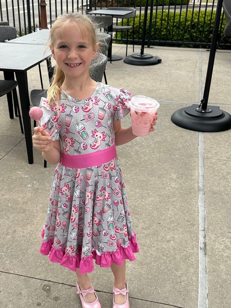 Pink axolotl and cups twirl dress. Features flutter sleeves, bow back is school approved, huge twirl, soft and stretchy material. Dress is designed with leucistic axolotls (pink axolotls) and inspired Starbucks drinks and cake pops Playful Summer Twirl Dress With Ruffle Sleeves, Playful Ruffle Sleeve Twirl Dress For Summer, Playful Twirl Dress With Ruffle Sleeves For Summer, Playful Twirl Dress With Ruffles And Short Sleeves, Playful Pink Twirl Dress With Flutter Sleeves, Playful Short Sleeve Twirl Dress With Ruffles, Playful Short Sleeve Twirl Dress, Fitted Whimsical Twirl Dress For Summer, Whimsical Fitted Twirl Dress For Summer