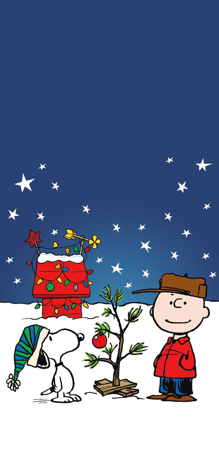 a charlie brown christmas card with a dog and a tree in the snow next to it