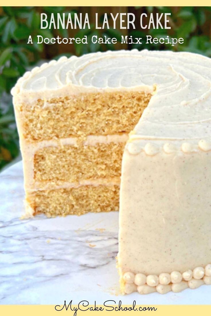 a close up of a slice of cake on a plate with the rest of the cake in the background