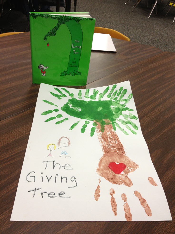 a child's handprint on a paper with the giving tree