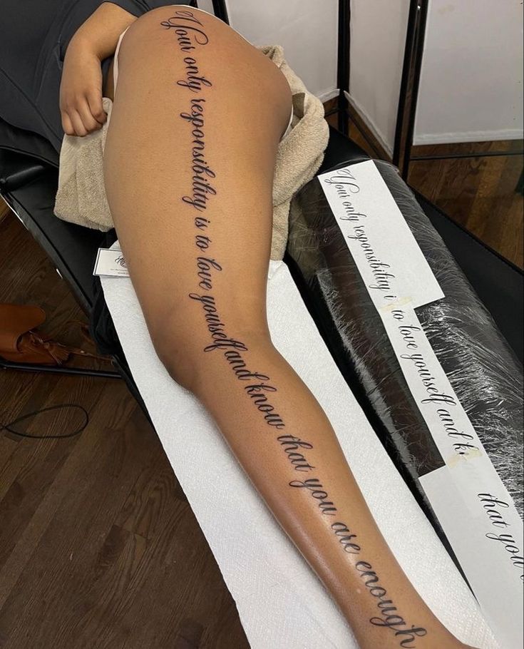 a woman's leg with writing on it