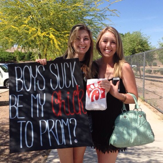 two young women holding signs that say boss suk be my friend to prom?