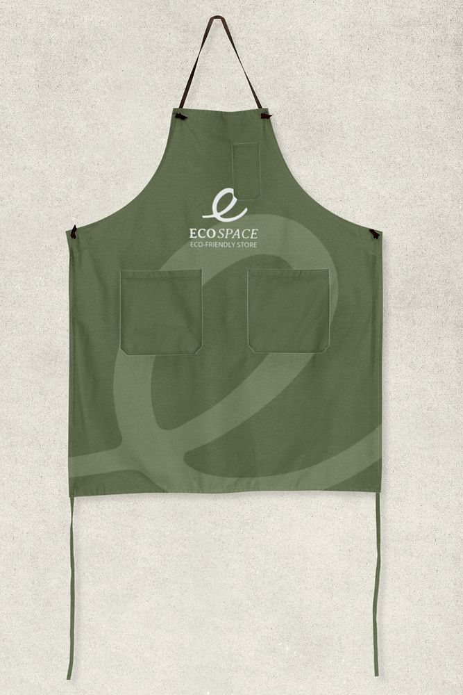 an apron hanging from the side of a wall with a logo on it and two pockets at the front