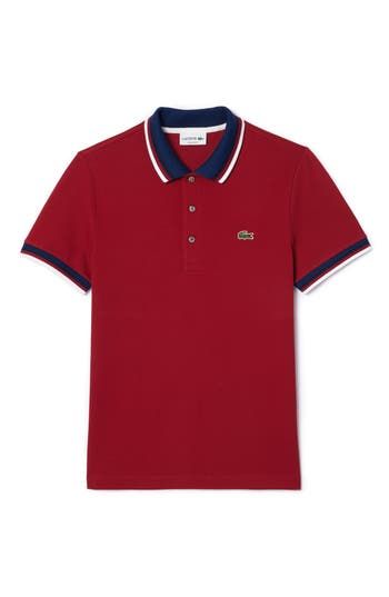 This polo embellished with the signature croc embroidery and a tipped collar is designed for everyday comfort with a classic cut and just-right stretch. Rib collar Short sleeves with rib cuffs 94% cotton, 6% elastane Machine wash, tumble dry Imported Classic Golf Polo Shirt With Ribbed Collar, Fitted Polo Shirt With Ribbed Collar For Golf, Classic Polo Shirt With Ribbed Collar For Golf, Classic Polo Shirt With Striped Collar For Golf, Classic Collared Polo Shirt With Ribbed Cuffs, Classic Red Polo Shirt With Striped Collar, Classic Fitted Polo Shirt With Striped Collar, Sporty Fitted Polo Shirt With Contrast Collar, Sporty Fitted Polo Shirt With Striped Collar