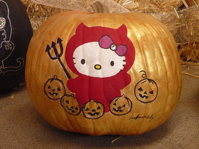 two pumpkins with hello kitty on them