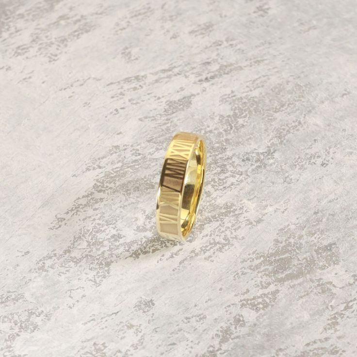 A stunning statement of love and devotion! Our Roman Numeral Ring is the perfect accessory for any special occasion, featuring a personalized inscription of your special date. A thoughtful and meaningful gift for any loved one, this custom ring makes for a memorable anniversary, birthday, or Mother's Day present. Yellow Gold Engraved Promise Ring, Tarnish Resistant, Elegant Tarnish-resistant Couple Rings For Anniversary, Tarnish Resistant Engraved Yellow Gold Promise Ring, Tarnish-resistant Yellow Gold Engraved Promise Ring, Elegant Promise Rings With Engraving Option, Modern 14k Gold Engraved Ring For Wedding, Engraved 14k Gold Promise Ring, Adjustable Tarnish-resistant Engraved Ring For Anniversary, Elegant Personalized Couple Rings