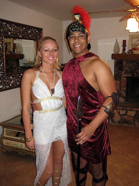 a man and woman dressed up in costumes