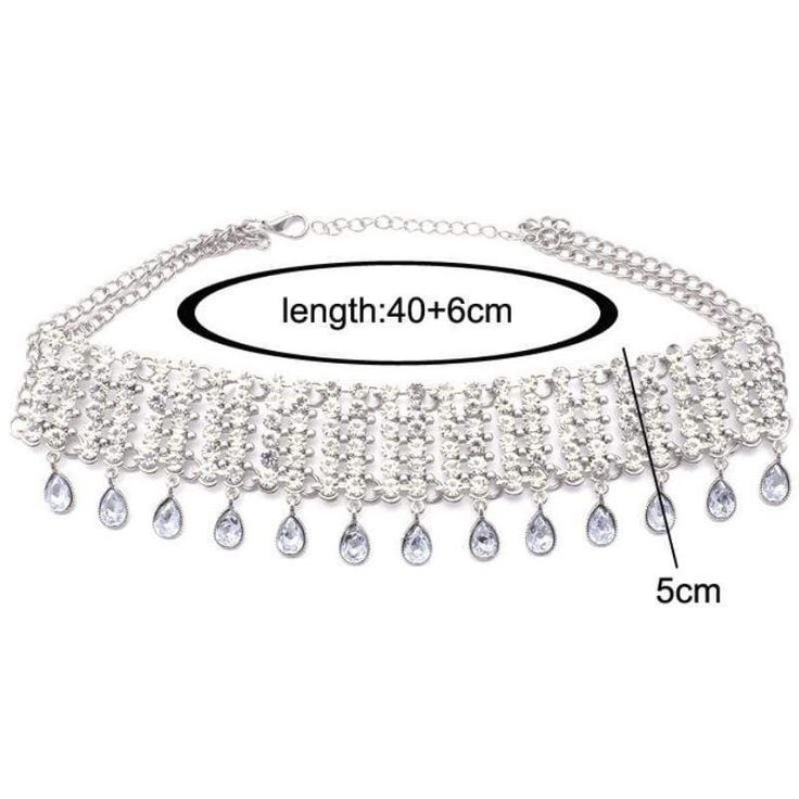 This AMAZING Statement Choker necklace is off the charts with sparkle and bling. Five rows full of white rhinestones join together in an amazing display with lovely faceted white teardrops dangling from the bottom. A piece sure to complete your elegant look, with a price you can afford. White Choker Necklace, White Choker, Statement Choker Necklace, Statement Choker, White Rhinestone, Diamond Necklace, Choker, Choker Necklace, Silver Necklace