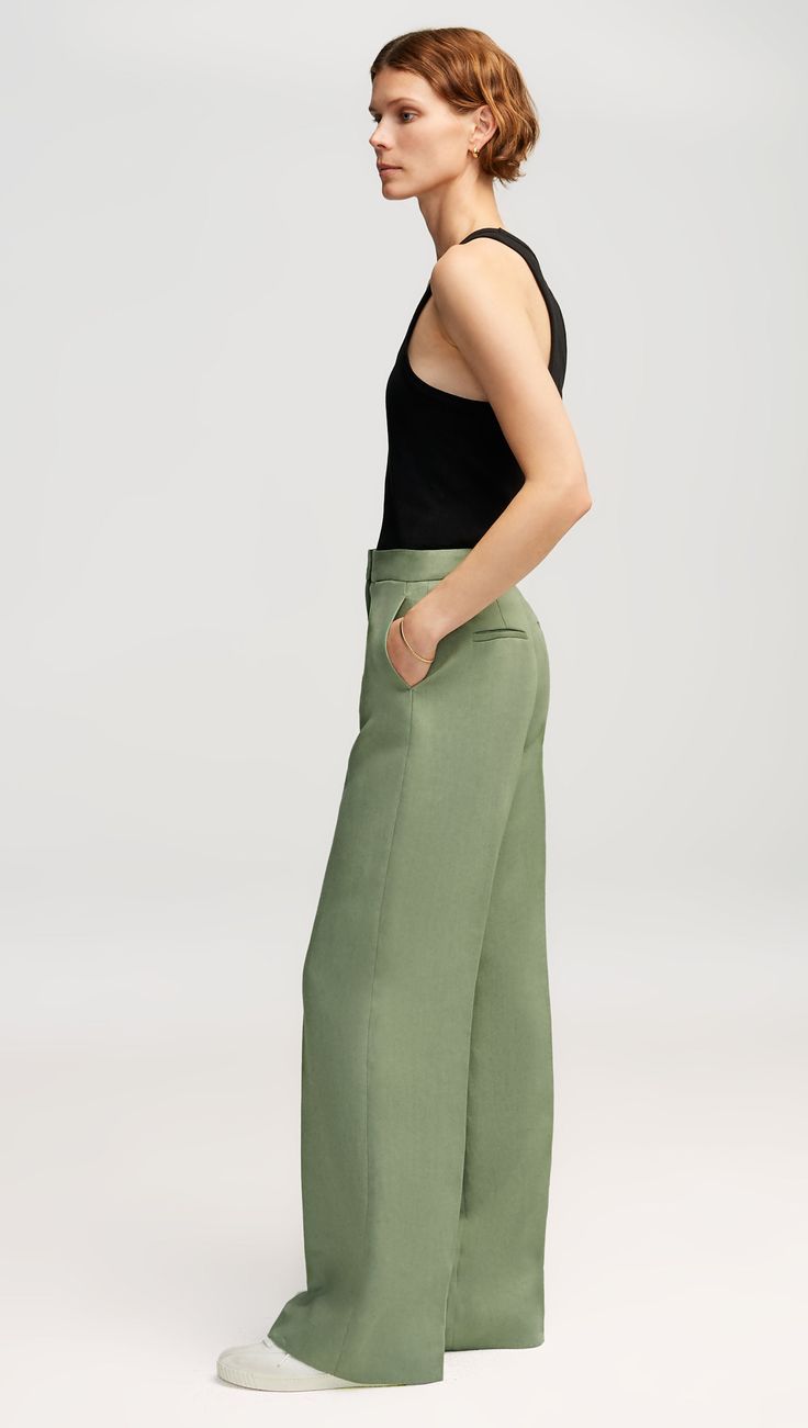 Made of Linen, this flattering silhouette features a high waist and a subtle wide leg. Functional details include an exterior credit card pocket, front side pockets and back welt pockets. Style with heels or sneakers; we recommend hemming according to your preferred shoe choice. Modern Wide Leg Pants With Welt Pockets, Modern Formal Wide Leg Pants For Summer, Fitted Wide Leg Pants With Straight Hem For Spring, Modern Wide Leg Pants With Pressed Crease, Modern Wide Leg Pants With Side Pockets, Spring Wide-leg Bottoms With Pressed Crease, Modern Wide Leg Bottoms With Pressed Crease, Wide-leg Bottoms With Pressed Crease For Spring, Modern High Waist Wide Leg Pants With Pockets