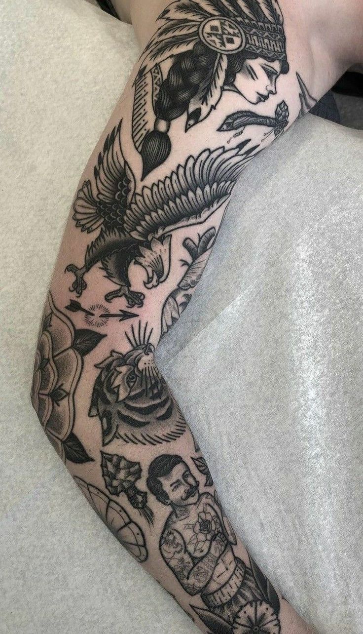 a person laying down with a tattoo on their arm