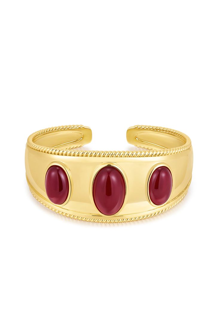 Statement bangle featuing 3 oval shaped dark red cabochon stones with a smooth and textured ridged bezel detail Bangle is 65mm x 50mm x 30mm Made from Brass Plated Gold or Silver Bangle is 100% nickel-free and cadmium-free 1 year warranty Packaged in Luv Aj branded gift boxes Part of the Camelia Farhoodi x Luv Aj Collection Camelia Farhoodi, Luv Aj, Branded Gifts, Crown Jewels, Shiraz, Stone Gold, Silver Bangle, Pink Bracelet, Bangles Jewelry