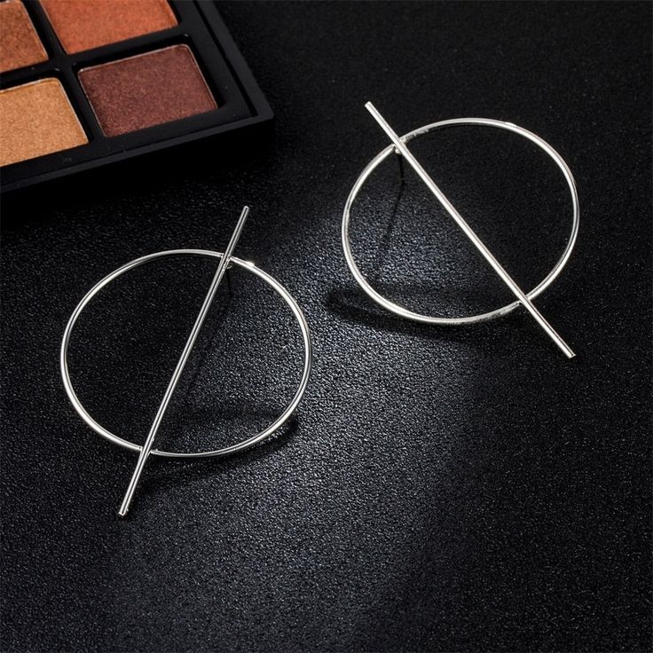 These exaggerated geometric big circle earrings are a stunning addition to your jewelry collection. Crafted with precision and attention to detail, these earrings feature bold shapes and a unique design that will elevate any outfit. Explore our exquisite selection and make a bold fashion statement today. Modern Metal Open Circle Hoop Earrings, Modern Circular Earrings For Party, Elegant Geometric Metal Hoop Earrings, Modern Geometric Metal Hoop Earrings, Minimalist Circle Earrings For Party, Big Circle Earrings, Female Punk, Oversized Earrings, Heart Dangle Earrings