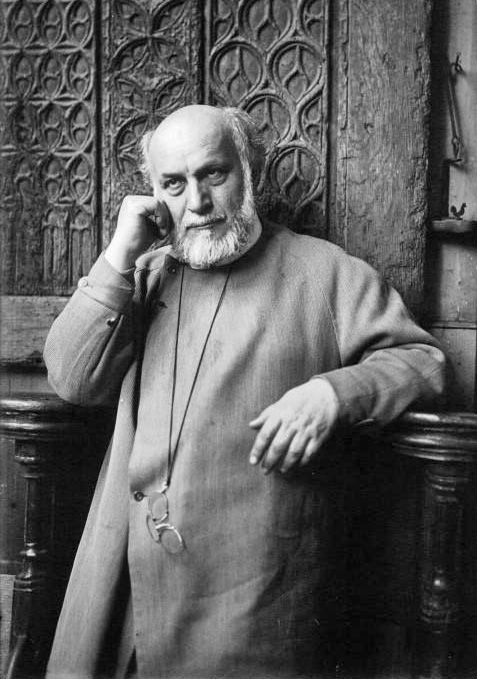 an old black and white photo of a man talking on the phone