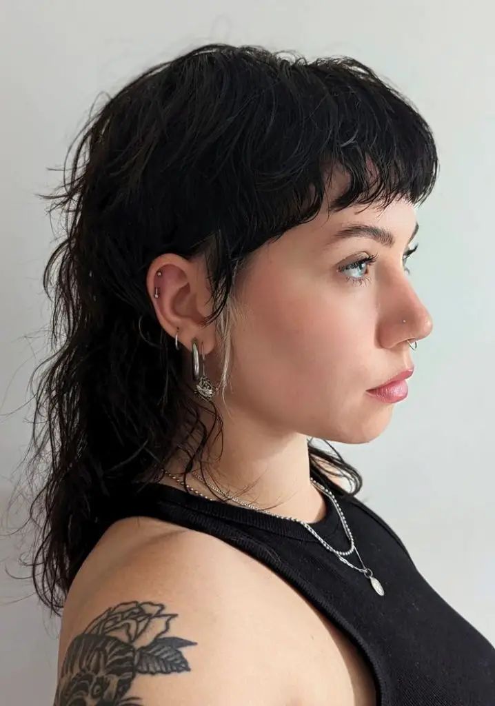 2024 Women’s Mullet Haircuts 18 Ideas: Trending Styles and Inspiration Trendy Wolf Haircut, Mullet Vs Shag, Microbangs Long Hair Mullet, Short Shag With Shaved Sides, Long Mullet Short Bangs, Womens Long Mullet, Skater Mullet Women, Shaggy Mullet Round Face, Microbangs Shag