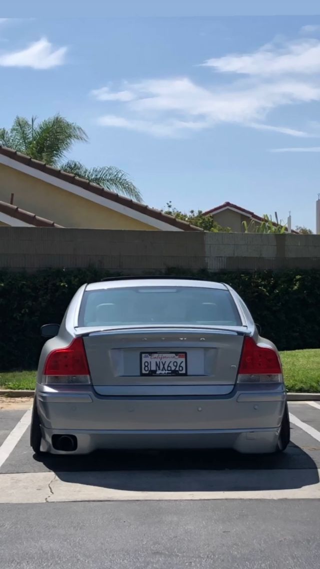 a silver car parked in a parking lot