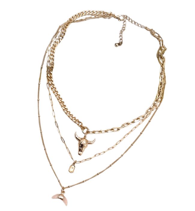 Rodeo Multi Layered Necklace – an exquisite blend of bohemian flair and contemporary elegance. This beautiful accessory is a statement piece that effortlessly combines various elements, creating a stunning multi-layered design that captivates attention. Crafted with meticulous detail, the Rodeo necklace features a combination of a bull horn, link chain, and natural bead on a gold chain, showcasing a harmonious blend of textures and shapes. The layers are thoughtfully arranged, creating a dynamic Bohemian Metal Charm Necklace With Clavicle Chain, Bohemian Metal Clavicle Chain Charm Necklace, Bohemian Pendant Chain Necklace For Party, Bohemian Charm Necklaces With Clavicle Chain For Party, Bohemian Multi-strand Clavicle Chain Necklace, Bohemian Multi-strand Clavicle Necklace, Bohemian Long Layered Necklace, Bohemian Clavicle Chain Choker Necklace, Bohemian Clavicle Chain Jewelry For Layering