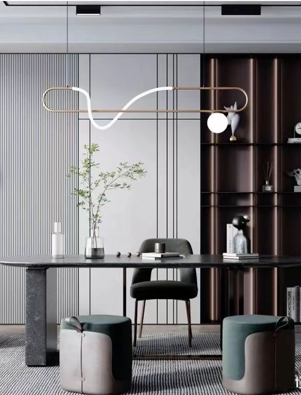 an elegant dining room with modern furniture and decor in shades of grey, white and black