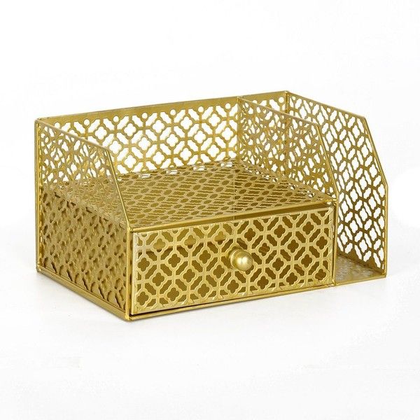 a golden metal box with an intricate design on the front and sides, sitting on a white surface