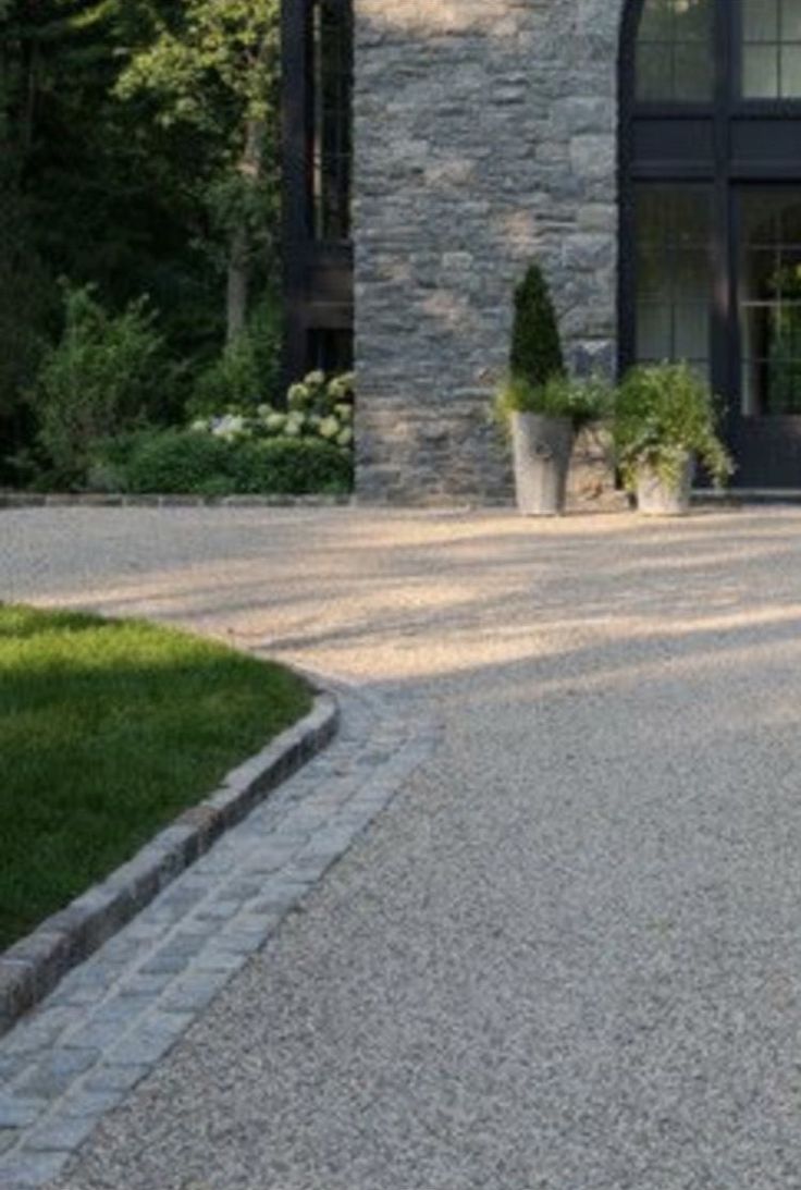 an image of a driveway that is being used by someone to drive down the road