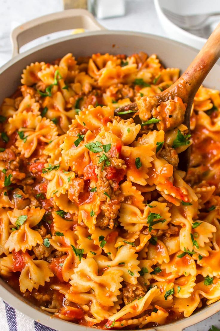 a large pot filled with pasta and meat