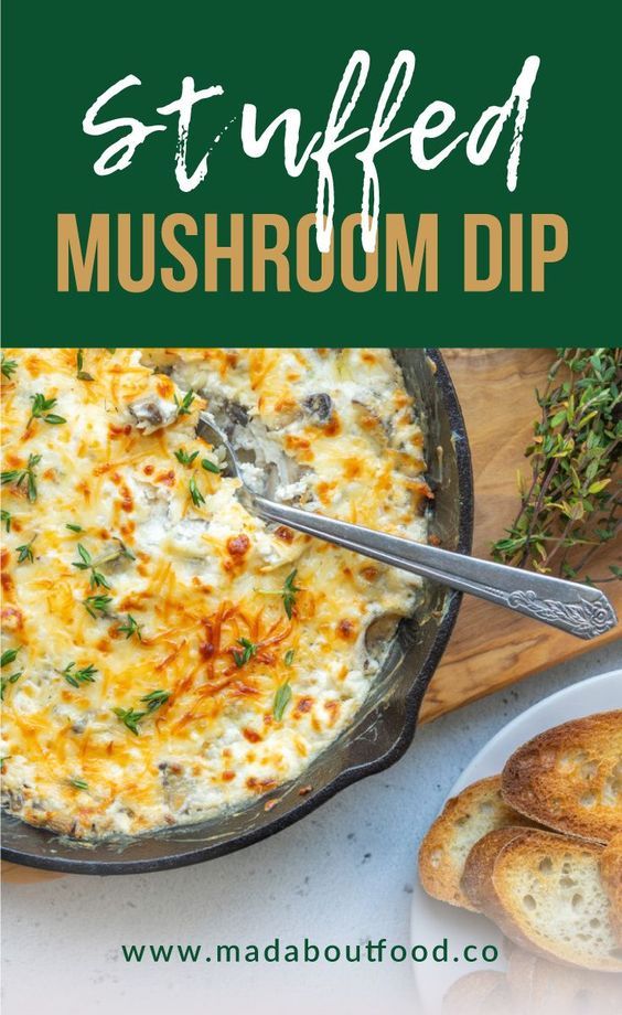 an image of stuffed mushroom dip in a skillet with bread and herbs on the side